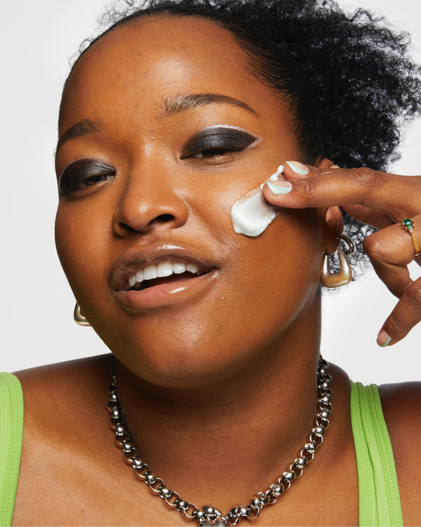 Model applying skincare